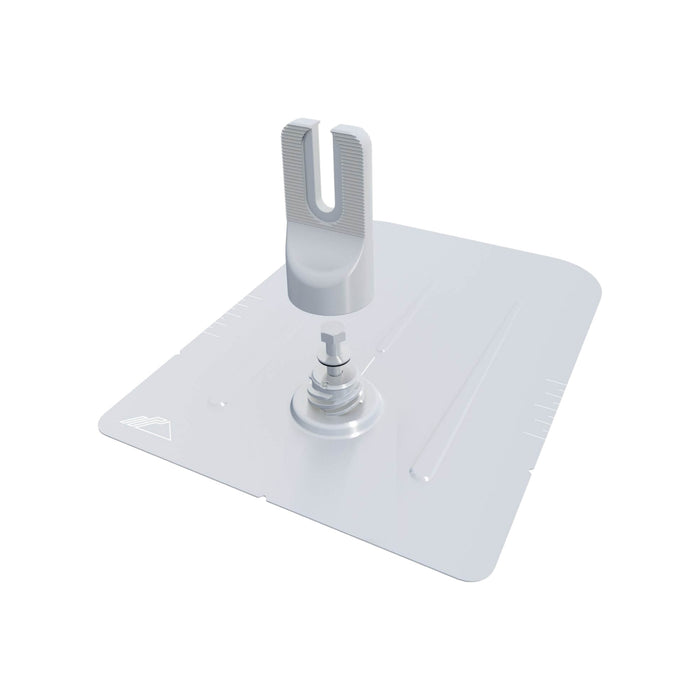 The IronRidge FF2-02-M2 FlashFoot2 2 Mill is a gray, U-shaped mechanical clamp with a twist-on cap design, attached to a flat rectangular base. It features scale markings along the edge and is designed by Ironridge for securely holding objects in place.