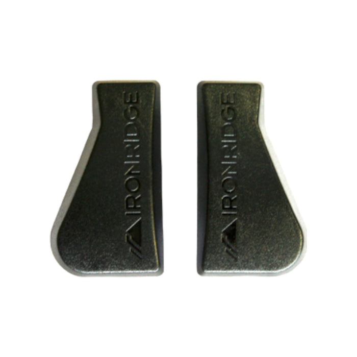 Two IronRidge XR-10-CAP End Caps, dark gray and flat with rounded edges, feature the text "IRONRIDGE" etched on their surfaces. Made from durable black polycarbonate, they are positioned side by side on a plain white background.
