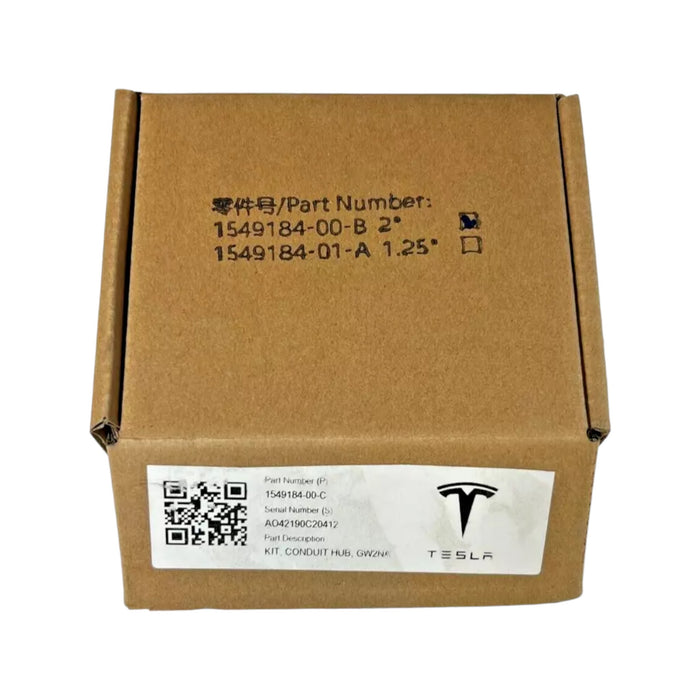 A cardboard box featuring Tesla branding shows off a label with part numbers, a barcode, and the description "Tesla Conduit Hub." The packaging seems to hold automotive parts or components.