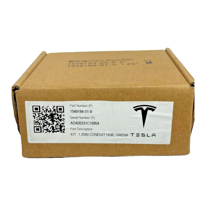 A cardboard box prominently featuring the Tesla logo and a label with a QR code. The label provides the part and serial numbers, describing the item as a Tesla Conduit Hub 1.25".