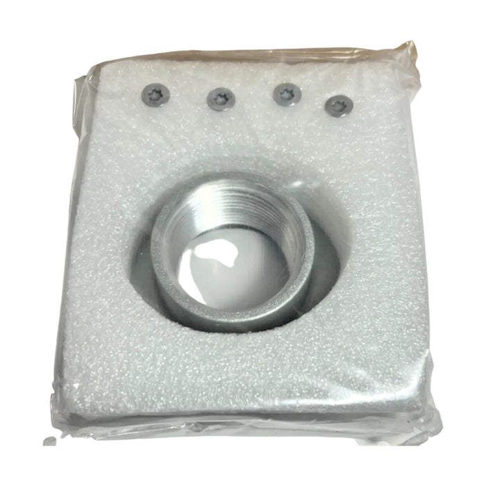 The Tesla Conduit Hub 1.25" is housed in a square foam casing with a circular cut-out, and the packaging includes three small screws at the top, all enclosed in clear plastic.