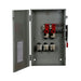 A gray Eaton DG224URK safety switch panel features multiple switches and wiring with red and black non-fusible components. A prominently positioned 200A, 2P, 240V safety switch is enclosed, and the door opens to the left, revealing a diagram or instructions suitable for outdoor use.