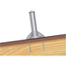 Close-up of the Ironridge QM-QBB-01-M1 Quick Mount Base Style Mount attached to a wooden surface, resembling the sturdy supports found in commercial roofing. The cylindrical silver mount by Ironridge is securely fastened with screws against the plain white background.